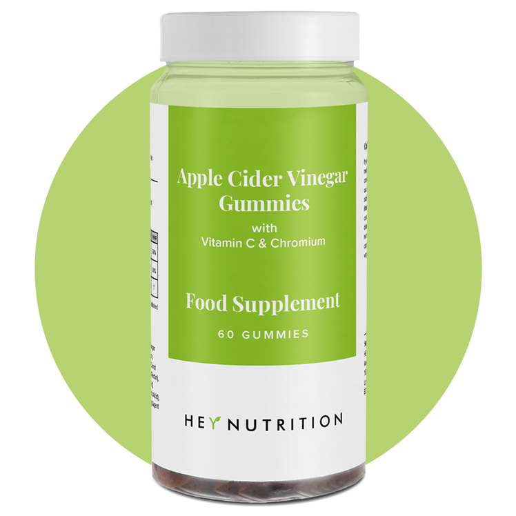 A Hey Nutrition Apple Cider Vinegar Gummies bottle with a green label, displayed on a light green circle background.