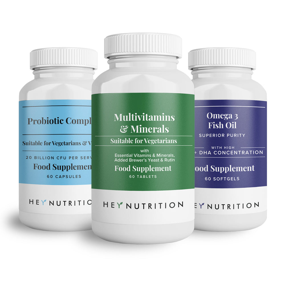 Close-up of three Hey Nutrition supplement bottles: Probiotic Complex, Multivitamins & Minerals, and Omega 3 Fish Oil on a white background