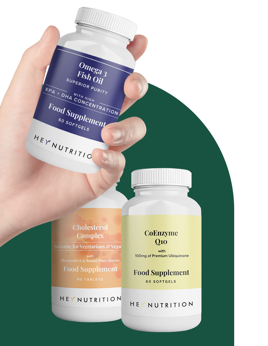 A hand presents the Omega 3 Fish Oil bottle in the foreground, with Cholesterol Complex and CoEnzyme Q10 bottles behind it, showcasing supplement variety and quality.