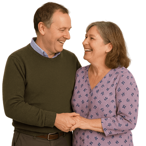Smiling older couple standing close together, holding hands and looking at each other warmly.